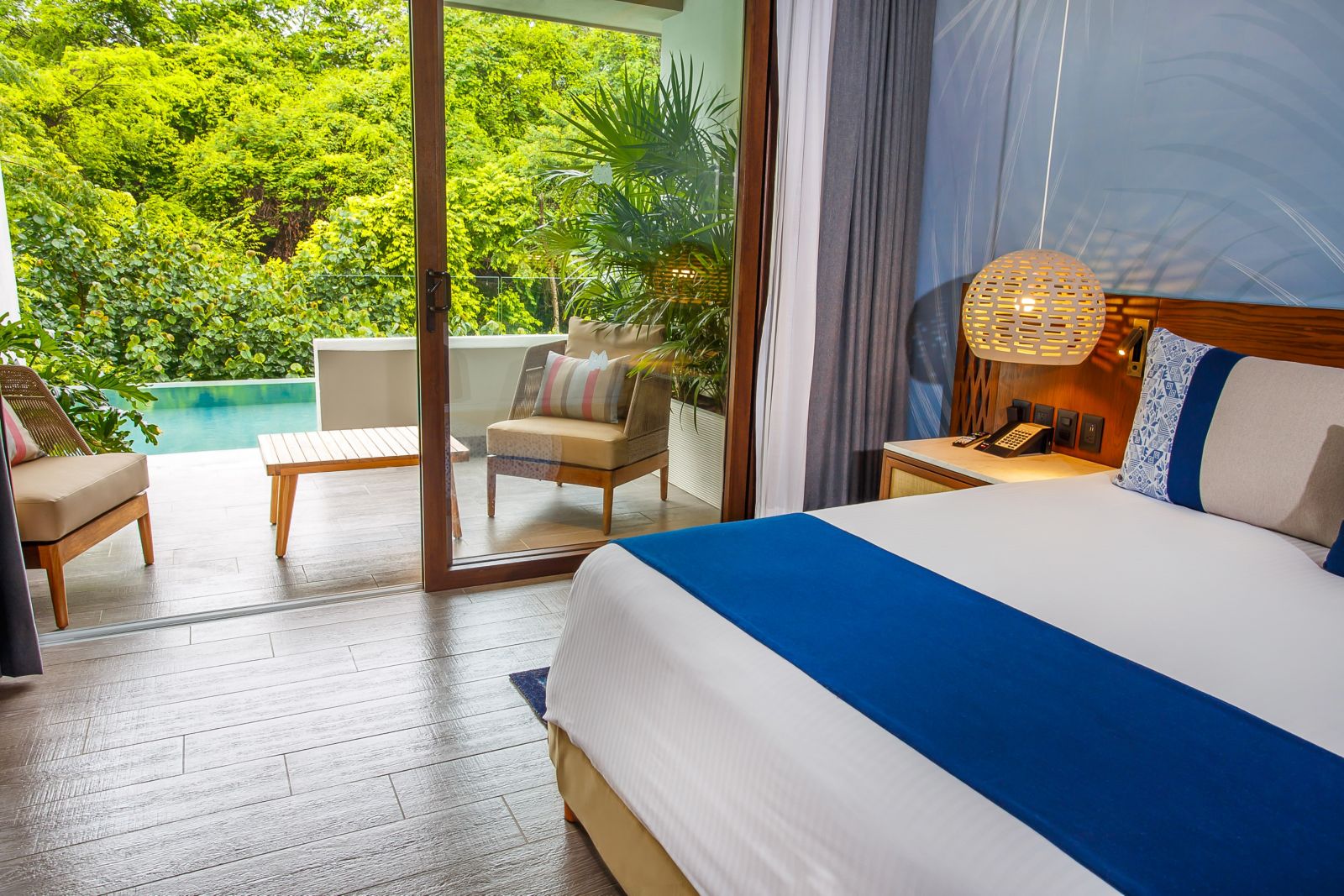 Swim-out suite with private plunge pool, jungle views, and modern tropical decor