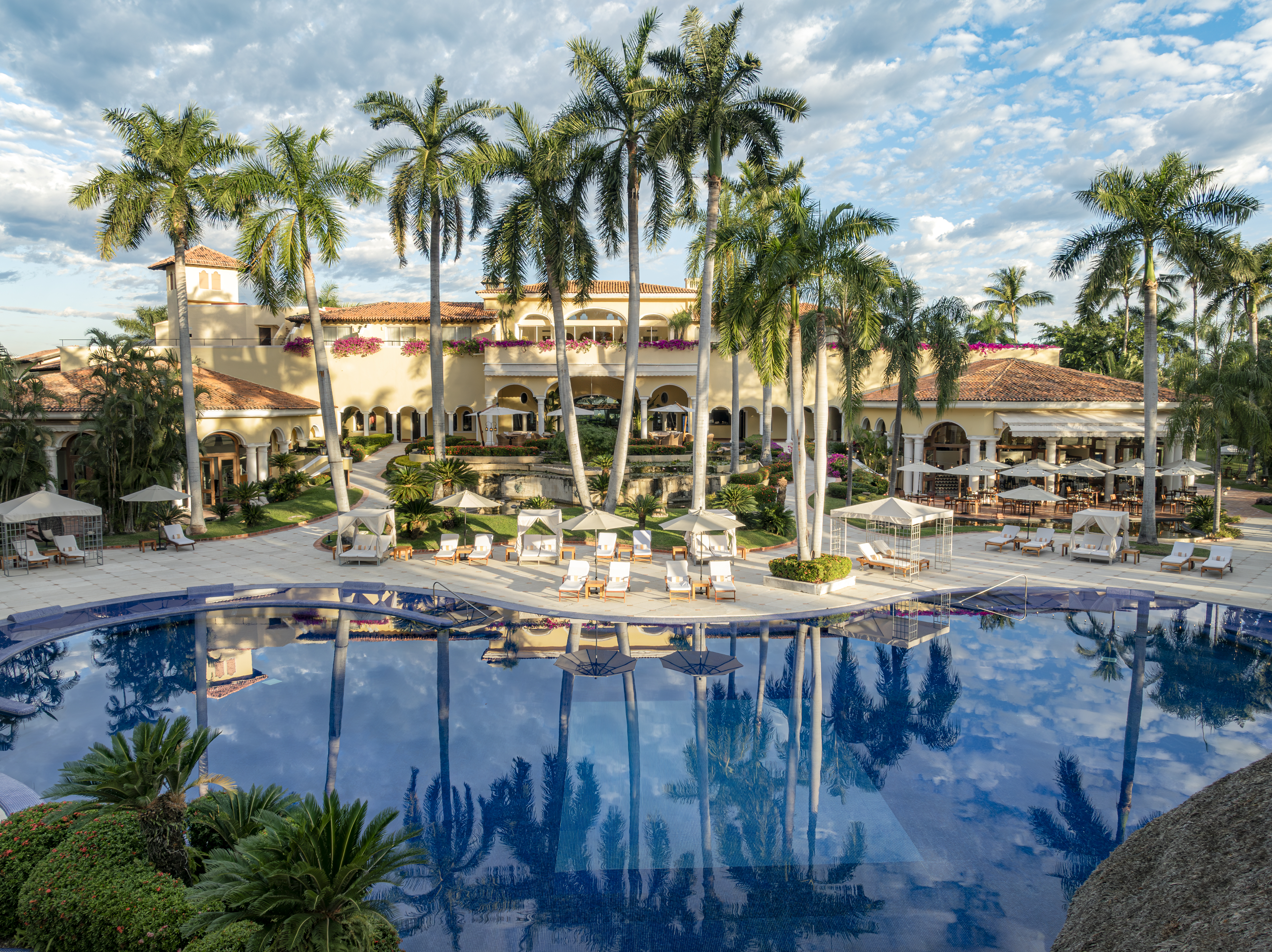 Main resort pool with swim-up Aqua Bar and cabanas