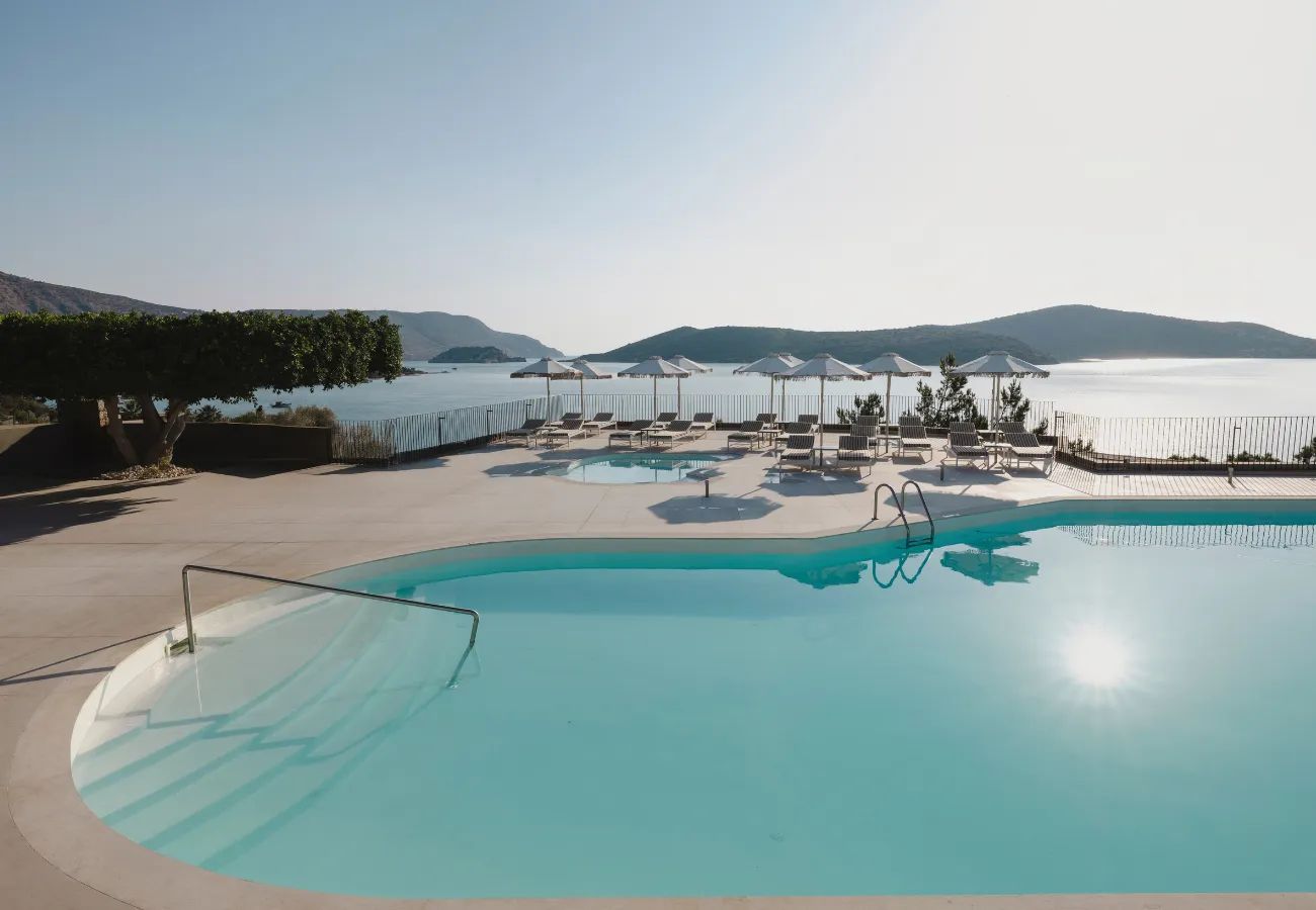 Swimming pool at Domes Aulūs Elounda, Curio Collection by Hilton