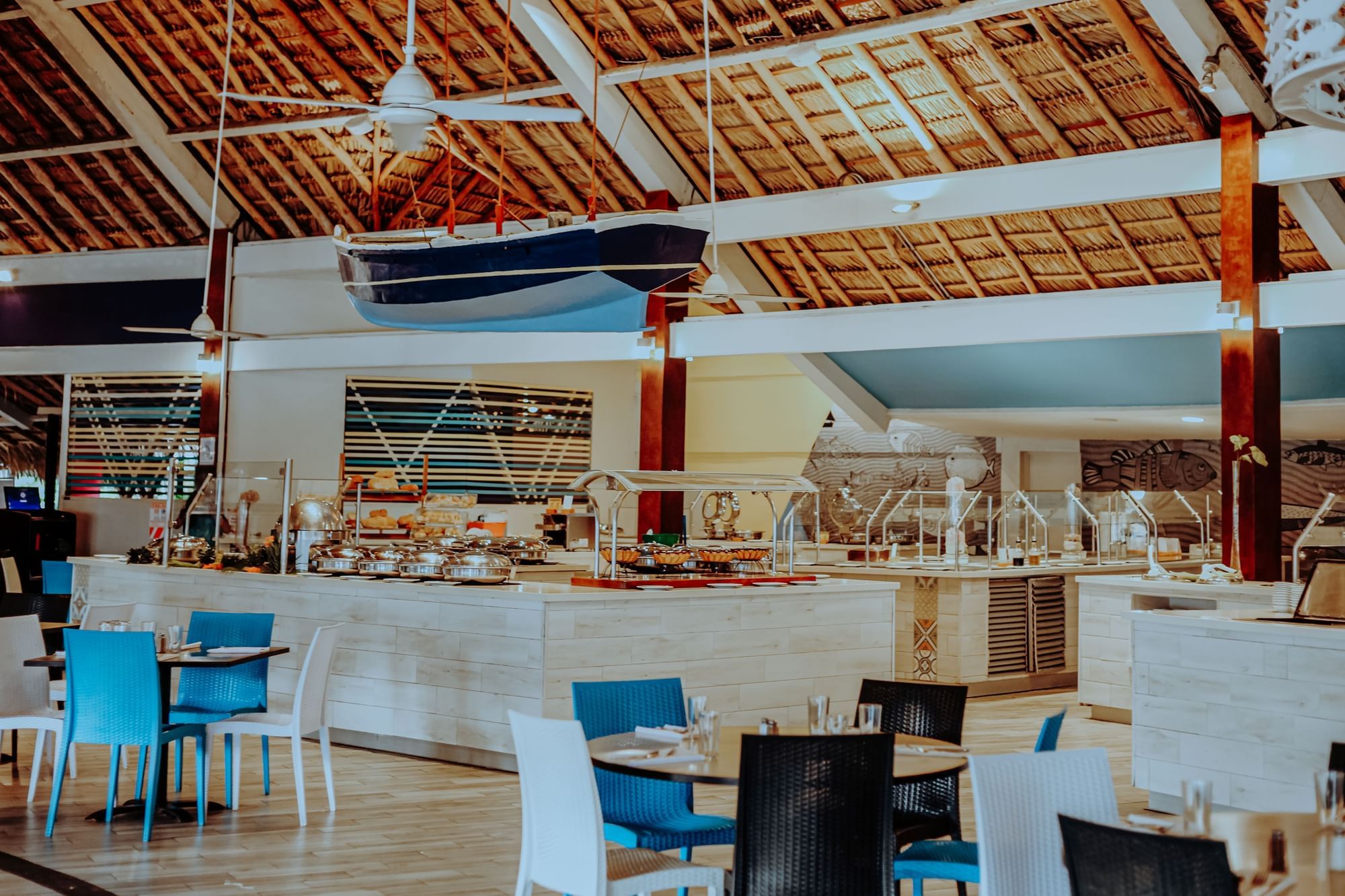Calypso buffet restaurant with open show kitchen serving breakfast, lunch, and themed dinners
