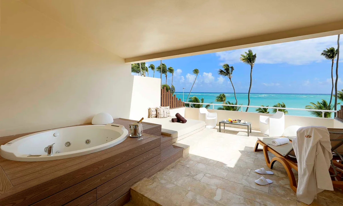 Rooftop Jacuzzi Terrace Junior Suite with private outdoor Jacuzzi, bar seating, and open-sky views