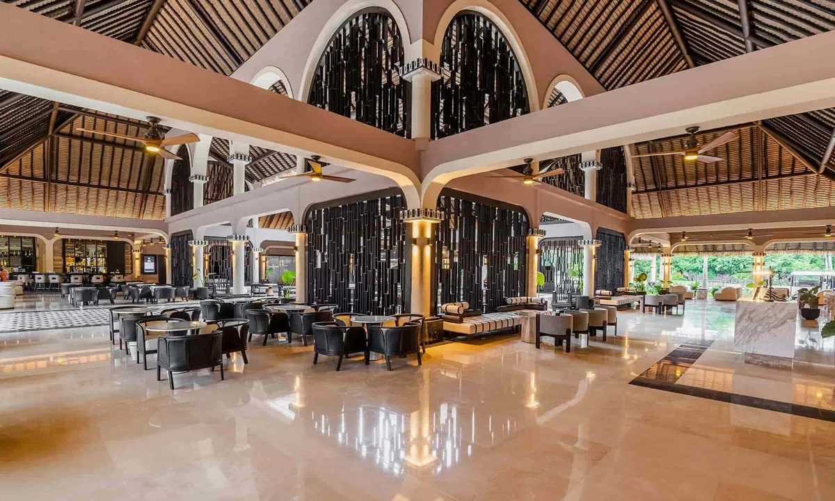 Grand Palladium Colonial lobby with elegant Spanish colonial design, vaulted ceilings, and tropical decor