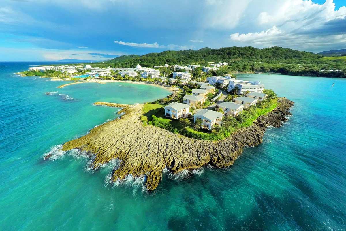 Activities and entertainment at Grand Palladium Jamaica including water sports, beach volleyball, tennis, reggae bands, and nightly theater shows