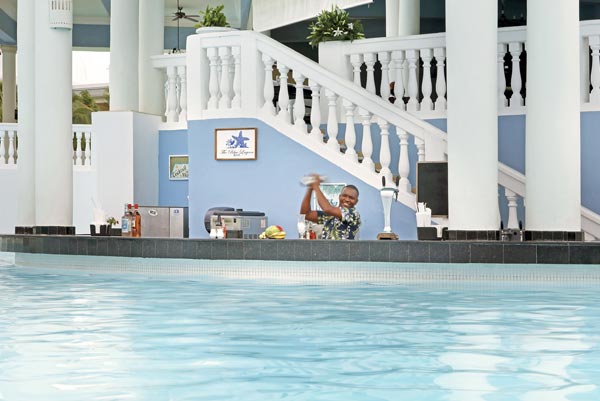 Infinite Indulgence all-inclusive experience at Grand Palladium Jamaica showing dining, pool, beach, and Caribbean lifestyle