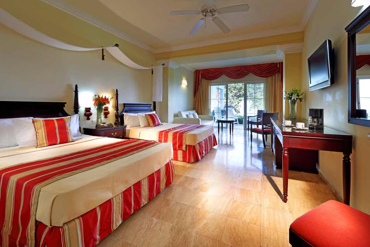 Panoramic view of Grand Palladium Jamaica Resort with low-rise villas nestled among palm trees along the Jamaican northwest coast