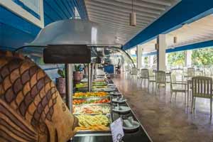 Poseidon beachfront Mediterranean restaurant at Grand Palladium Lady Hamilton with open-air seating and Caribbean Sea views