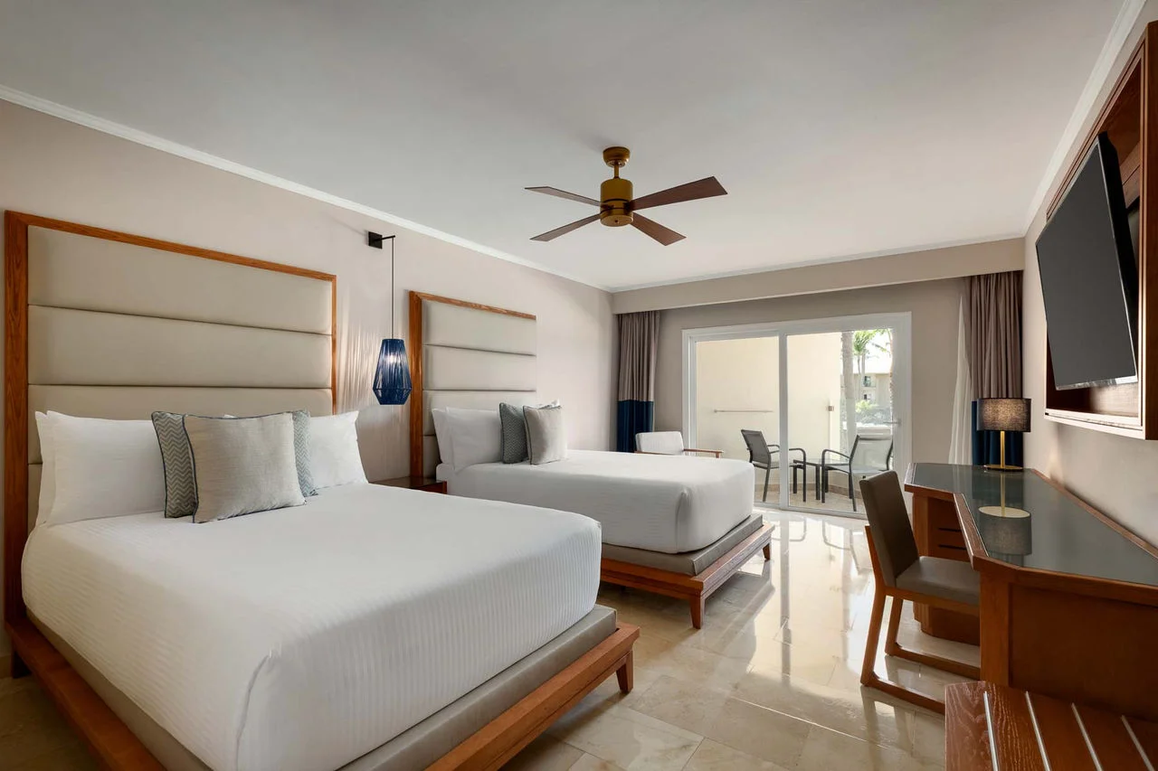 Deluxe Poolside room featuring hydromassage bathtub and furnished terrace