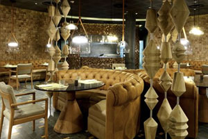 El Dorado steakhouse featuring charcoal-grilled meats in a refined dining setting with spectacular views