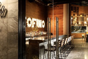 Portofino Italian restaurant with elegant dining room, exposed kitchen, and Mediterranean-inspired decor