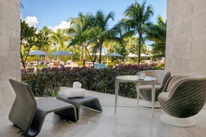 Junior Suite Pool Access with direct step-out terrace to the pool, hammock, and modern suite amenities