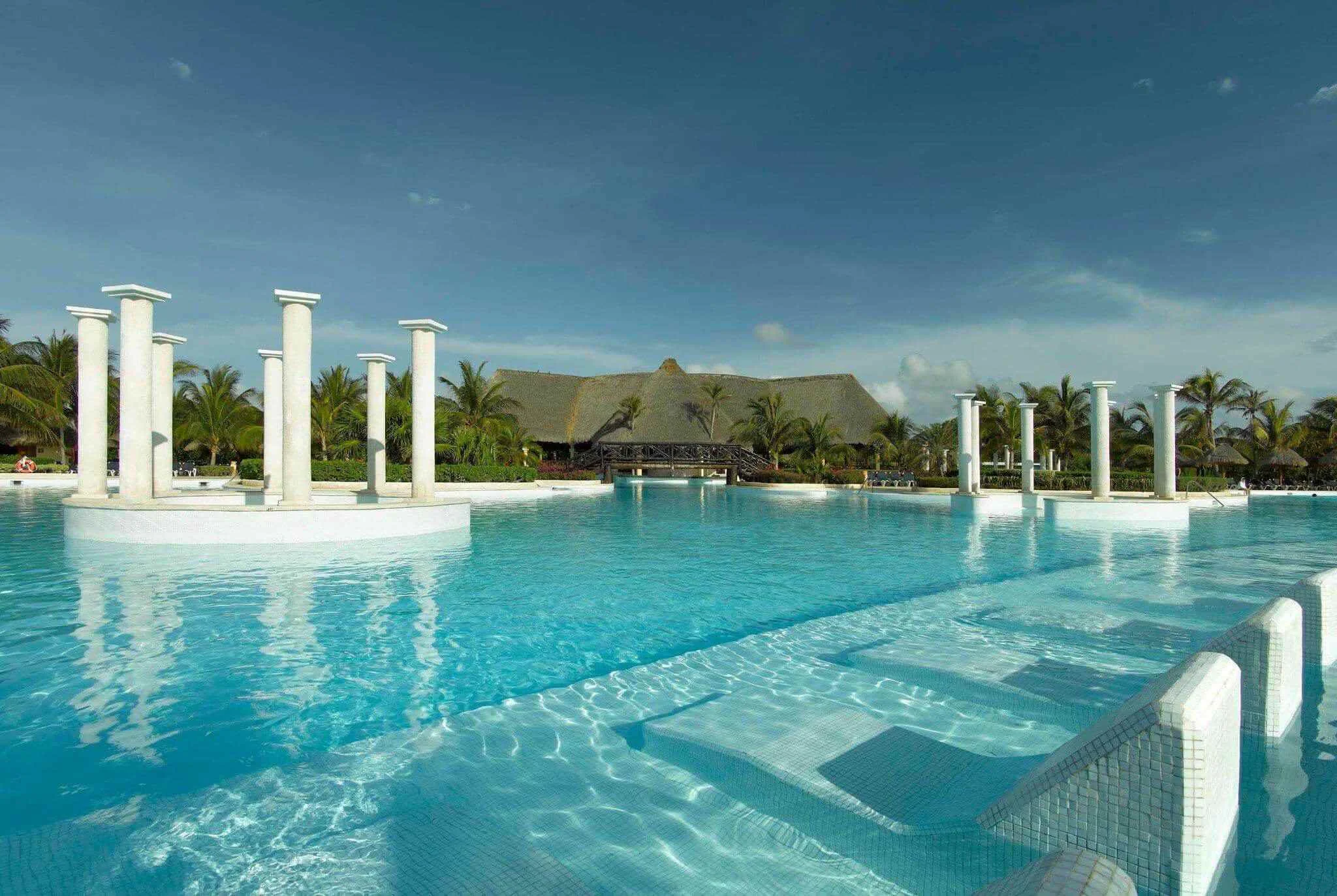 Main lagoon pool spanning 3,224 square meters with tropical garden surroundings