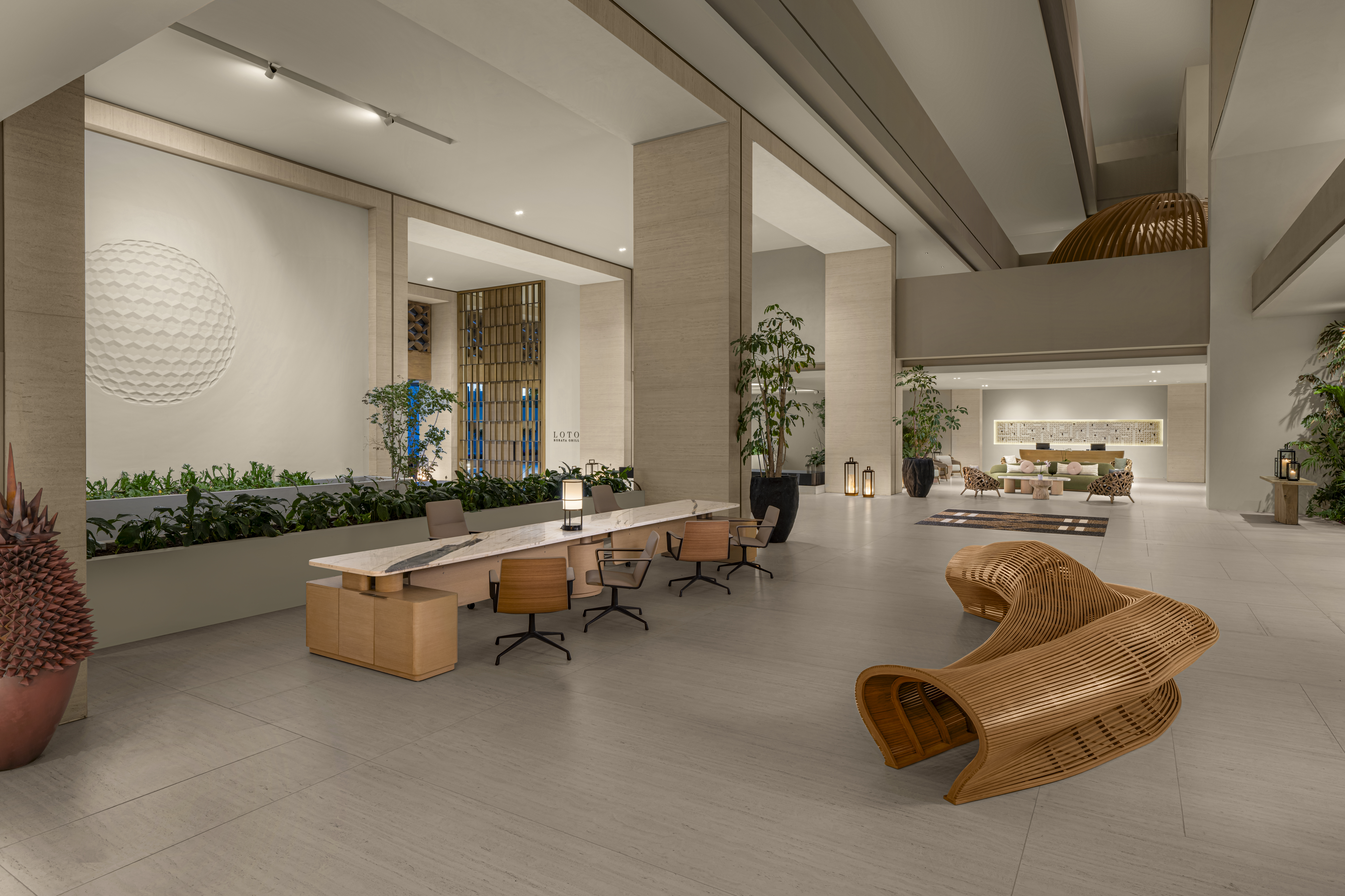 Contemporary open-air lobby with soaring ceilings and ocean views