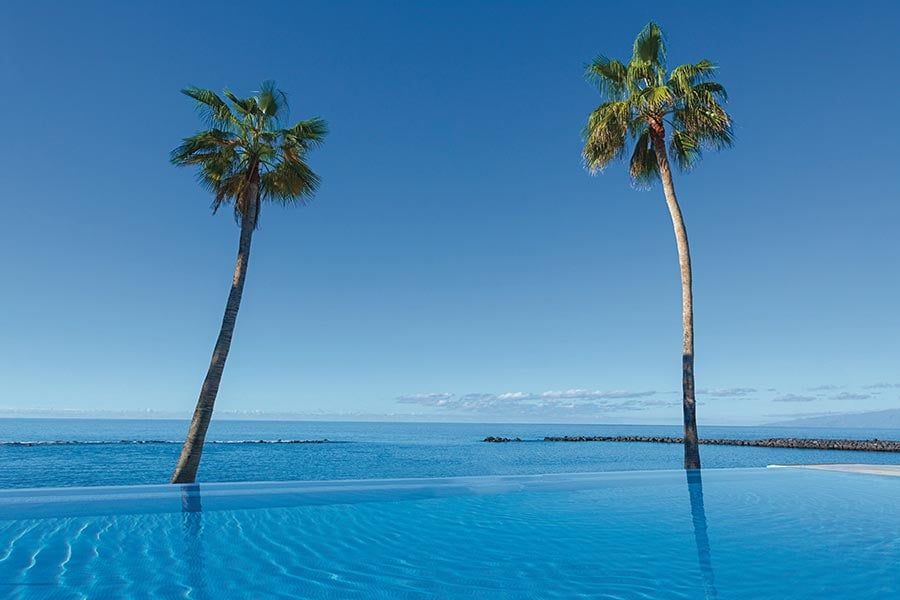 Swimming pool area at Hotel Riu Arecas