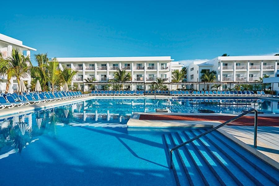 Swimming pool area at Hotel Riu Bambu