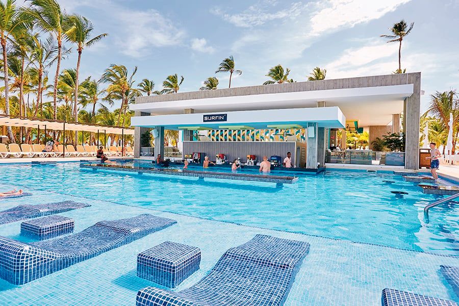 Swimming pool area at Hotel Riu Bambu