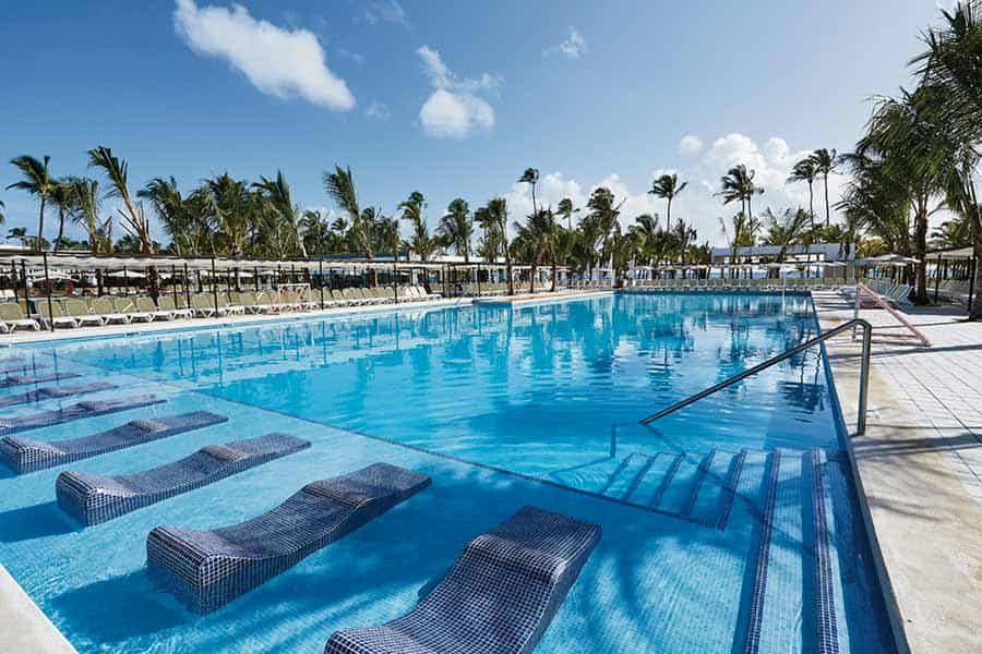 Swimming pool area at Hotel Riu Bambu