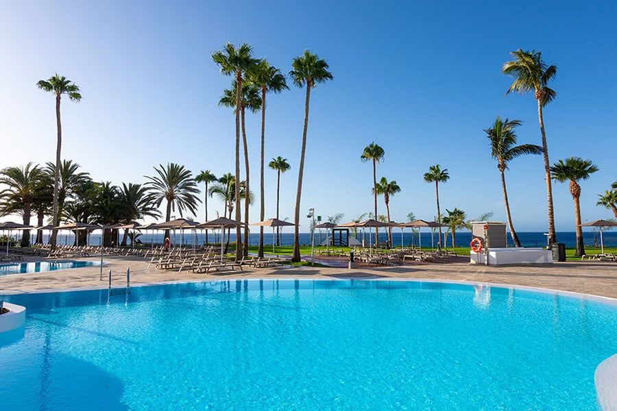 Swimming pool area at Hotel Riu Calypso
