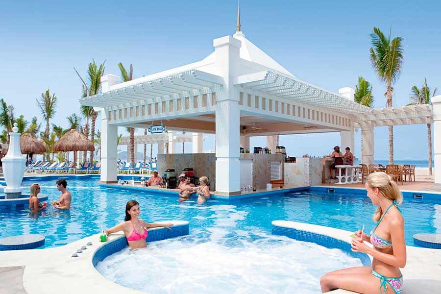 Swimming pool area at Hotel Riu Emerald Bay