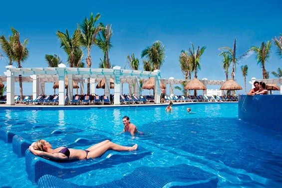 Swimming pool area at Hotel Riu Emerald Bay
