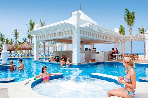 Swimming pool area at Hotel Riu Emerald Bay