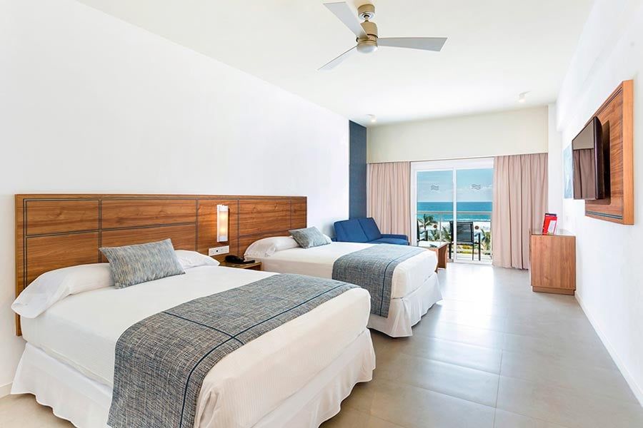 Guest room at Hotel Riu Emerald Bay