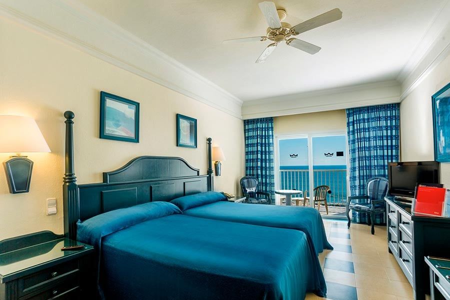 Guest room at Hotel Riu Emerald Bay