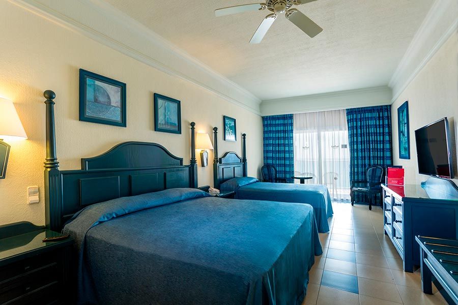 Guest room at Hotel Riu Emerald Bay