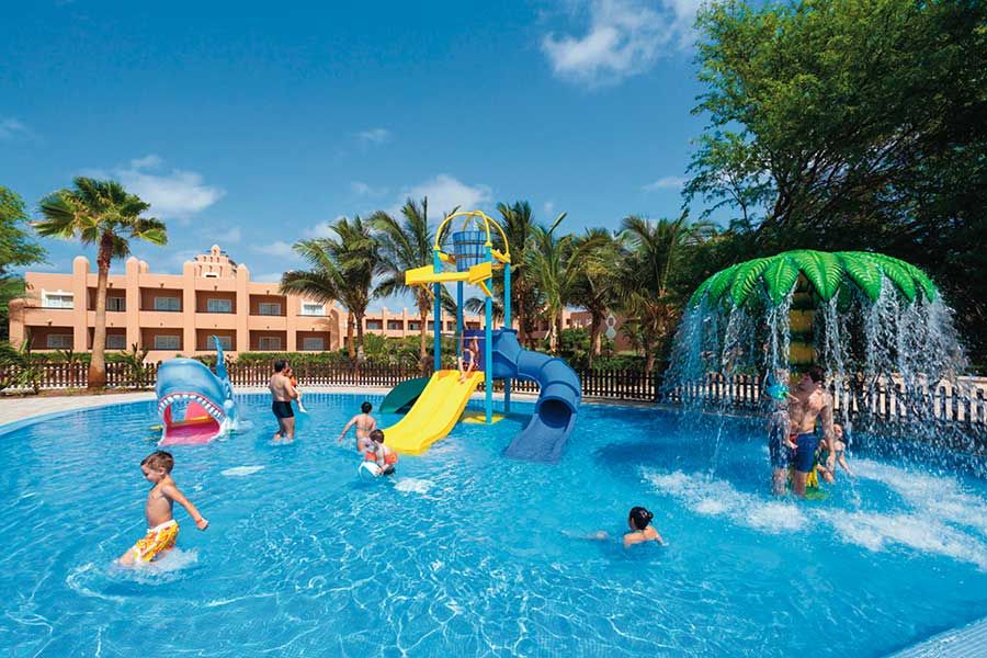 Swimming pool area at Hotel Riu Funana