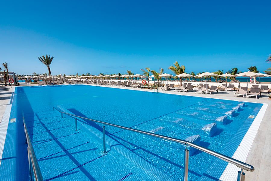 Swimming pool area at Hotel Riu Karamboa