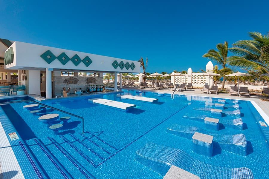 Swimming pool area at Hotel Riu Karamboa