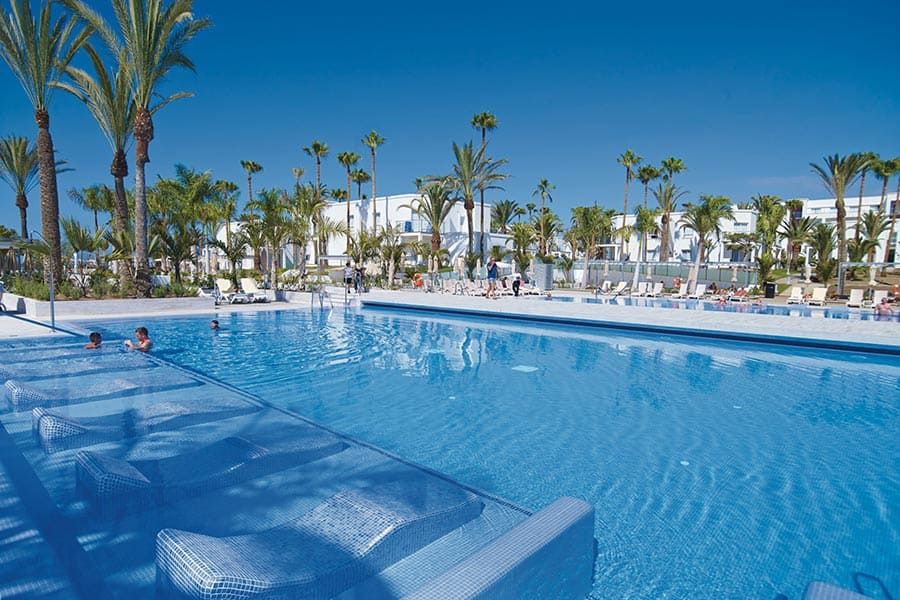 Swimming pool area at Hotel Riu Palace Meloneras