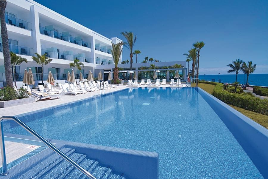 Swimming pool area at Hotel Riu Palace Meloneras