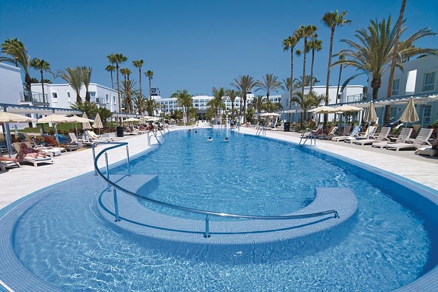 Swimming pool area at Hotel Riu Palace Meloneras