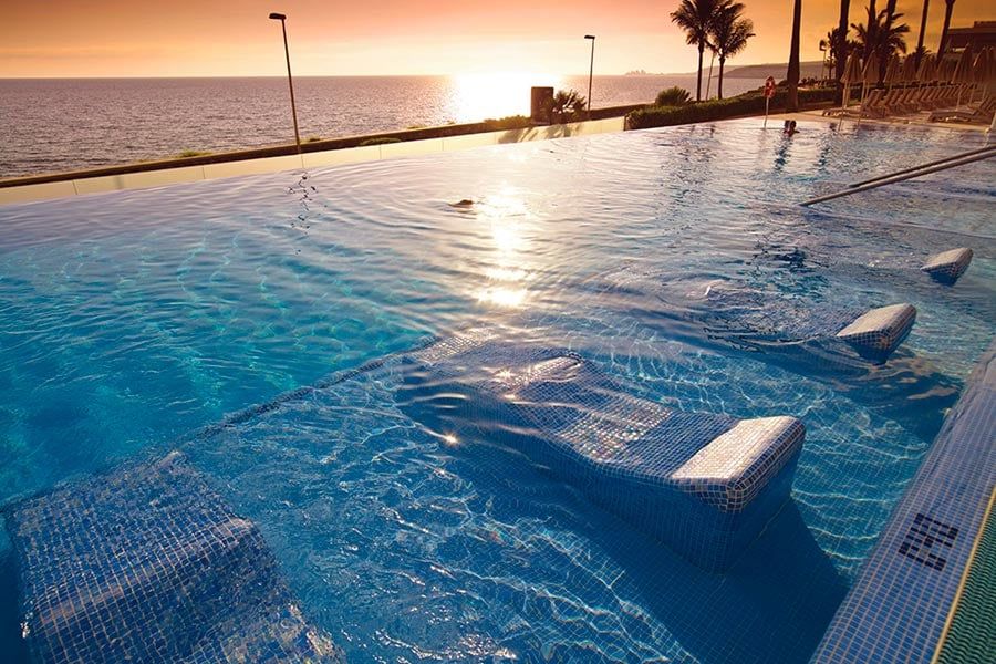 Swimming pool area at Hotel Riu Palace Meloneras