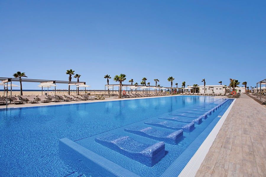 Swimming pool area at Hotel Riu Palace Santa Maria