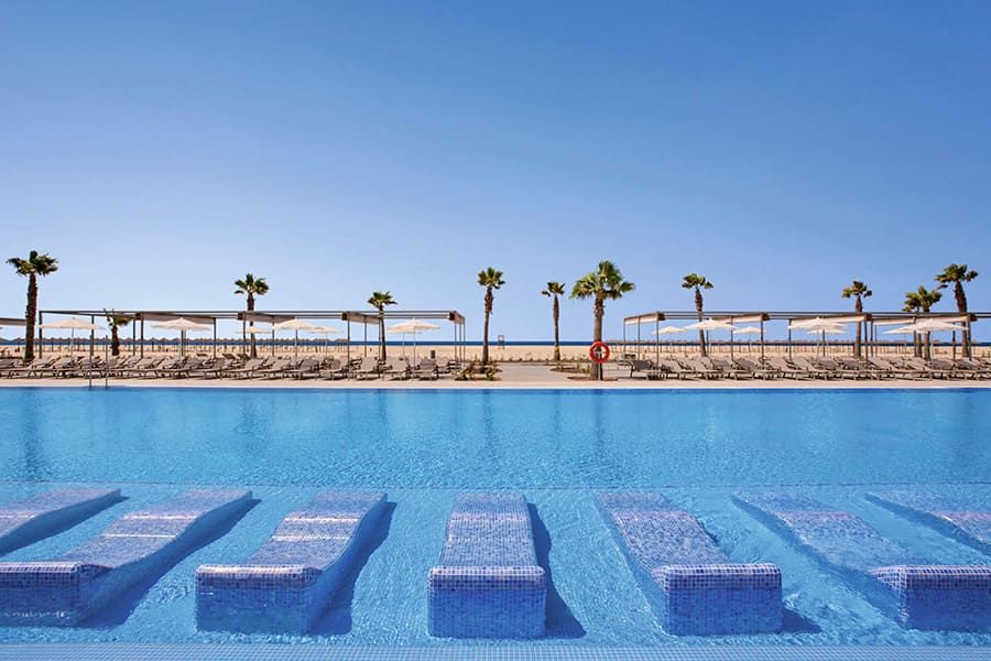 Swimming pool area at Hotel Riu Palace Santa Maria