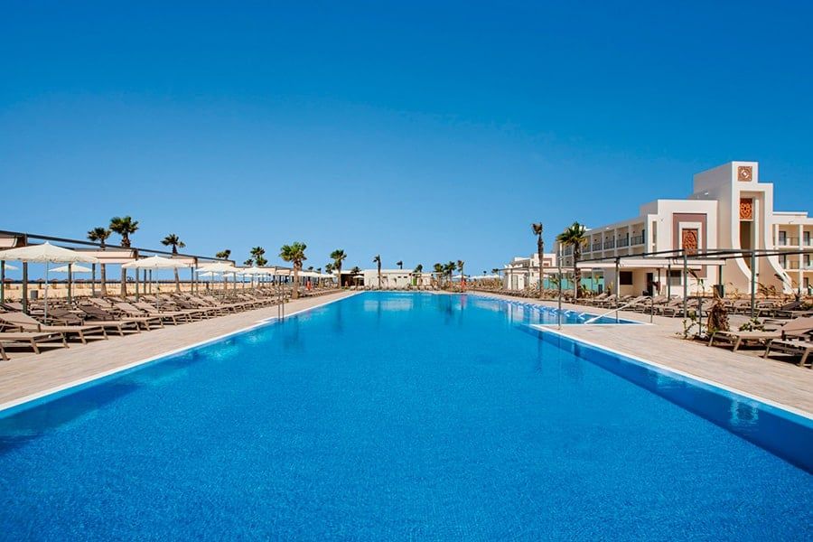 Swimming pool area at Hotel Riu Palace Santa Maria
