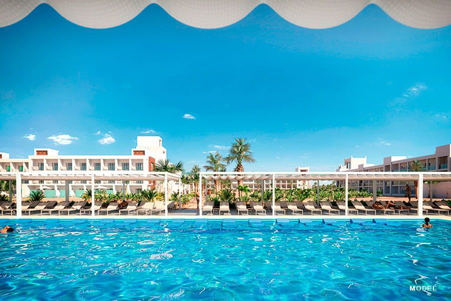 Swimming pool area at Hotel Riu Palace Santa Maria