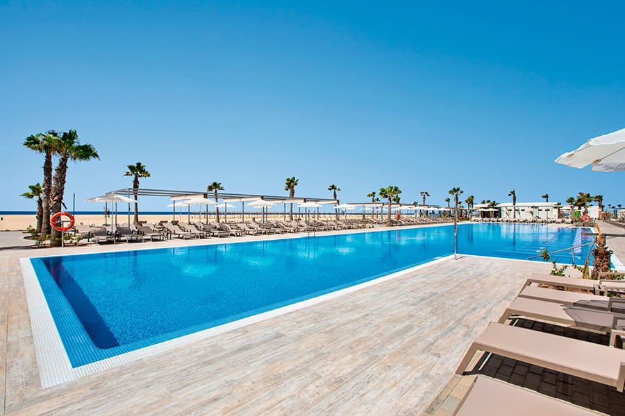 Swimming pool area at Hotel Riu Palace Santa Maria