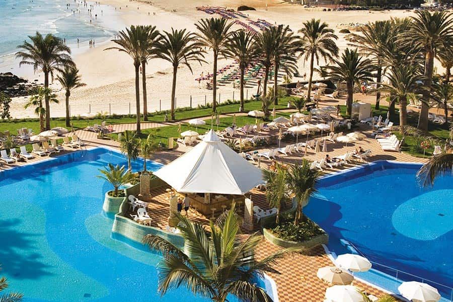 Swimming pool area at Hotel Riu Palace Tres Islas