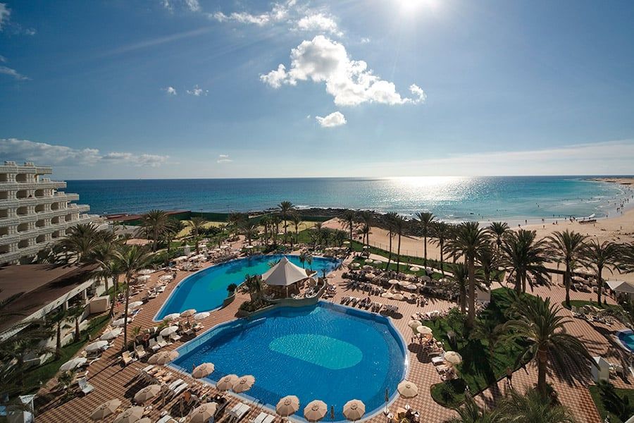 Swimming pool area at Hotel Riu Palace Tres Islas