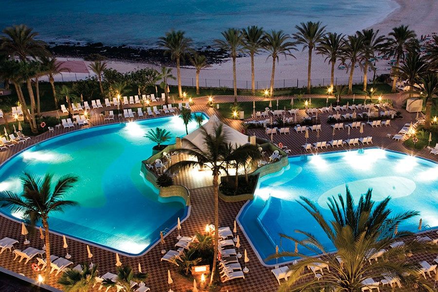 Swimming pool area at Hotel Riu Palace Tres Islas
