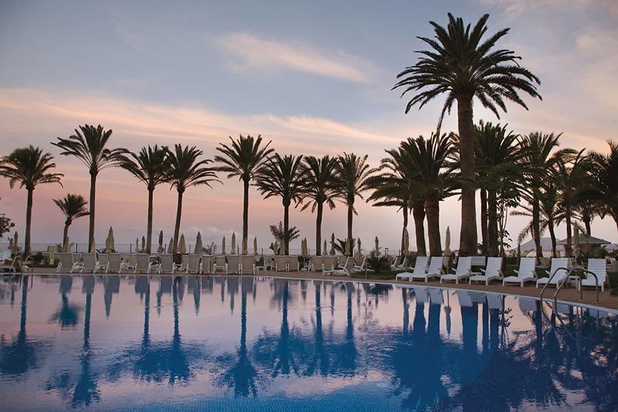 Swimming pool area at Hotel Riu Palace Tres Islas