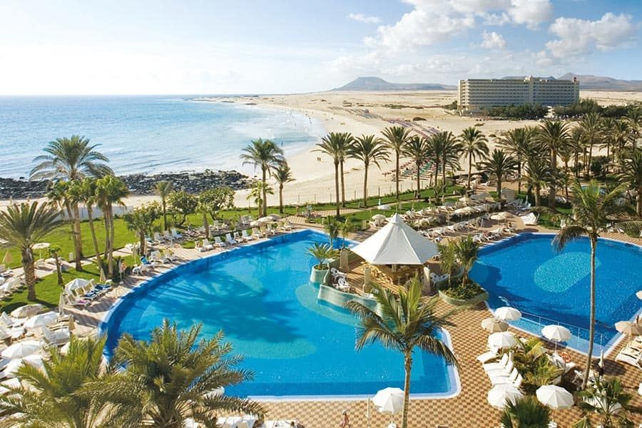 Swimming pool area at Hotel Riu Palace Tres Islas