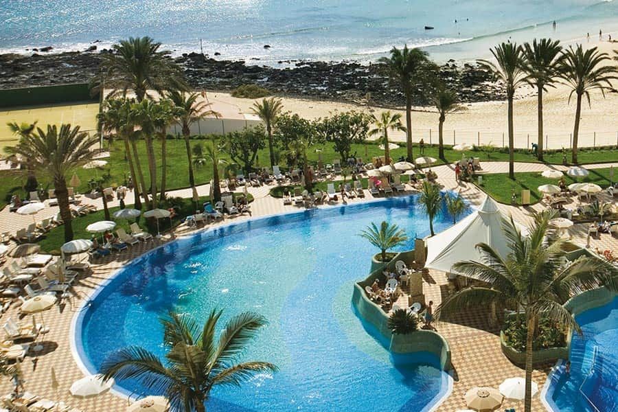 Swimming pool area at Hotel Riu Palace Tres Islas