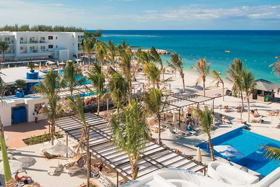 Swimming pool area at Hotel Riu Reggae