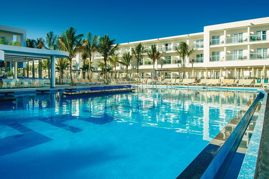 Swimming pool area at Hotel Riu Reggae