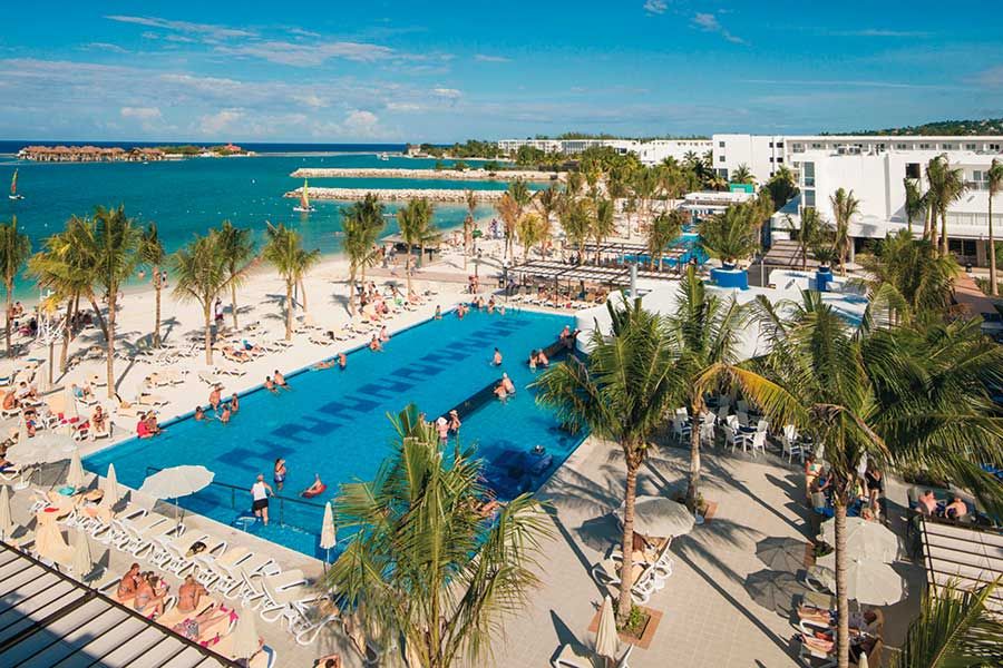 Swimming pool area at Hotel Riu Reggae