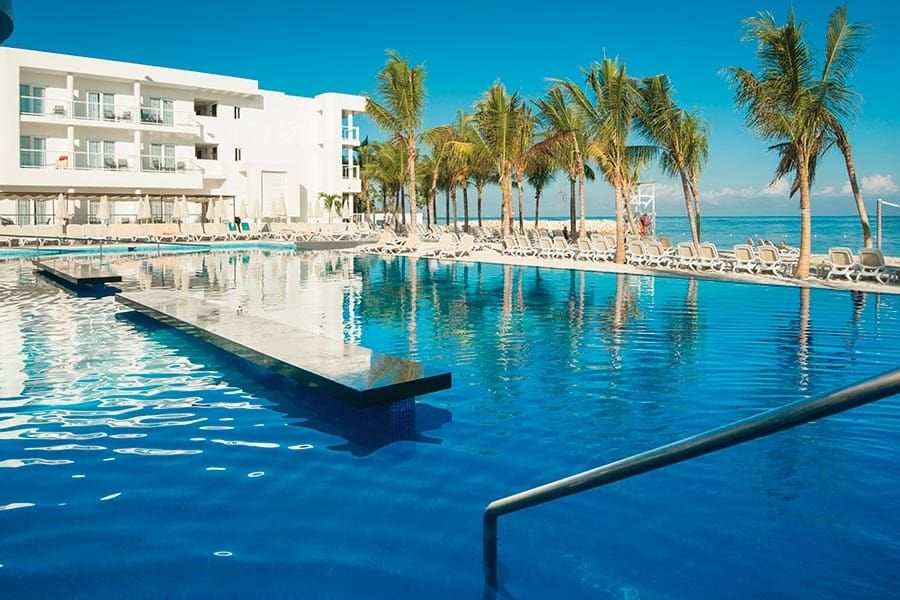 Swimming pool area at Hotel Riu Reggae
