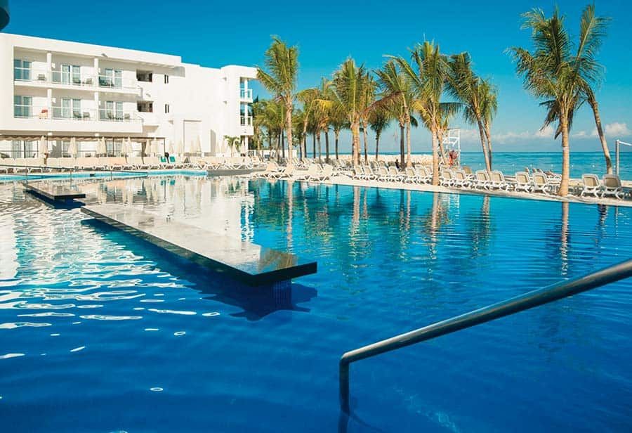 Swimming pool area at Hotel Riu Reggae
